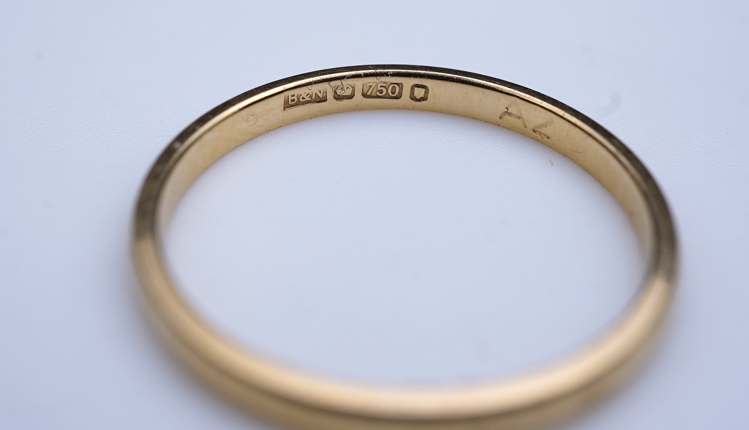 A diamond ring and two gold wedding rings